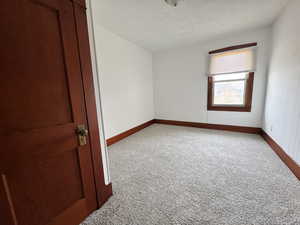 Spare room with carpet flooring