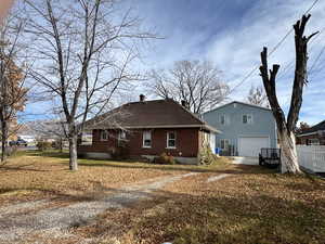 Back of house with a garage