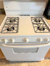 Room details with white gas range