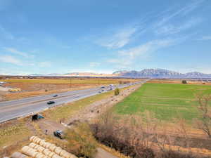 Birds eye view of property with a mountain view and a rural view