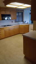 Kitchen featuring white gas stovetop and sink