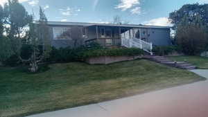 View of front of home with a front yard