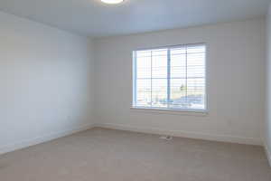 View of carpeted spare room