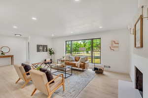 Living room with light hardwood / wood-style floors