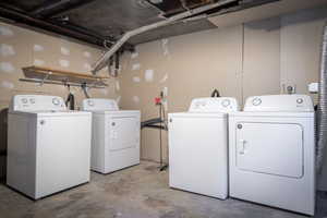 Washroom featuring washer and clothes dryer