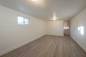 Basement featuring light hardwood / wood-style flooring