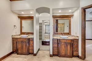 Bathroom with tile patterned flooring and vanity