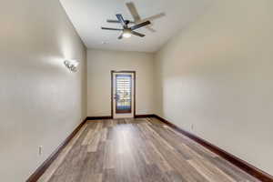 Unfurnished room featuring ceiling fan and light hardwood / wood-style flooring