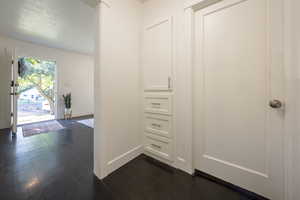 Hallway featuring dark hardwood / wood-style floors