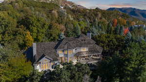 Aerial view at dusk featuring a mountain view