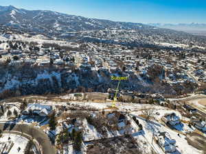 Snowy aerial view featuring a mountain view