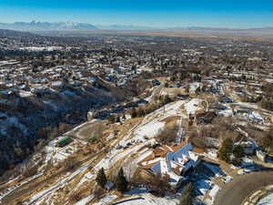 Snowy aerial view featuring a mountain view