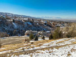 Snowy aerial view featuring a mountain view