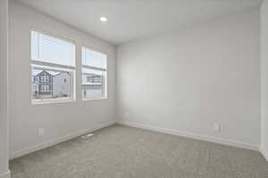 Unfurnished room with carpet floors