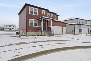 View of front of home featuring central air condition unit