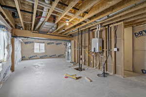 Basement featuring tankless water heater