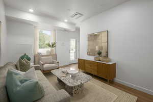 *Model Home Photo. Living room with wood-type flooring