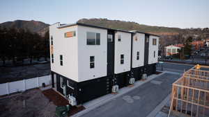 View of side of home featuring a mountain view