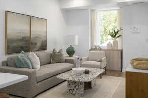 *Model Home Photo. Living room with light wood-type flooring