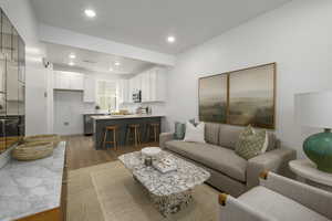 *Model Home Photo. Living room with sink and light hardwood / wood-style flooring