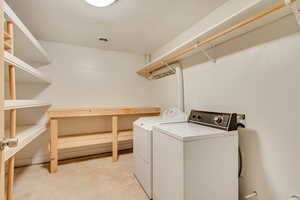 Laundry area featuring independent washer and dryer