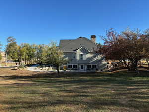 Exterior space featuring a yard