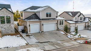 View of front of property featuring a garage