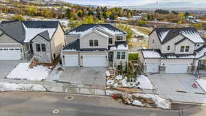 View of front of home featuring a mountain view and a garage