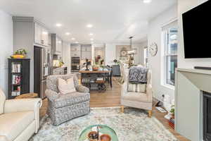 Living room with light wood-type flooring