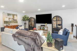 Living room featuring light carpet