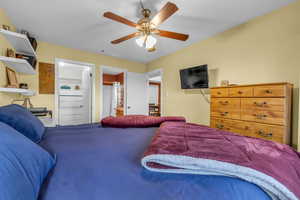 Bedroom with connected bathroom and ceiling fan