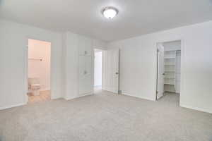 Main Bedroom viewing into main closet and main bathroom.