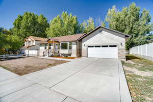 View of front of home featuring a garage and future RV Parking