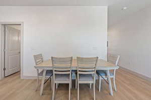 Dining space with light wood-type flooring