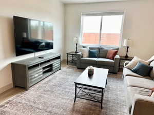 Living room with light wood-type flooring