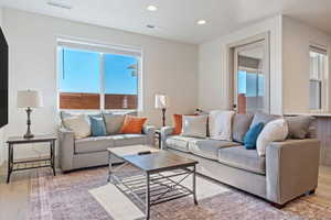 Living room with hardwood / wood-style floors