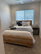 Bedroom featuring carpet flooring and ceiling fan