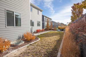 View of home's exterior with a yard