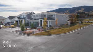 View of front of house featuring a mountain view and cooling unit