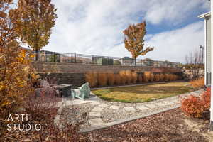 View of yard featuring a patio and an outdoor fire pit