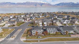 Aerial view featuring a water and mountain view