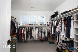 Spacious closet with carpet floors