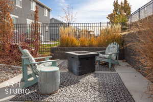 View of patio / terrace with an outdoor fire pit