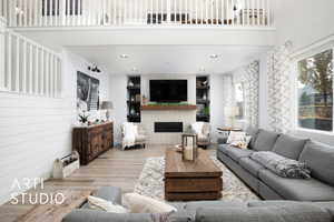 Living room featuring a high ceiling, light wood-type flooring, and wooden walls