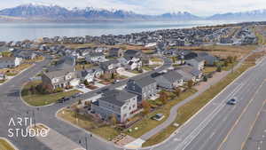 Birds eye view of property with a water and mountain view