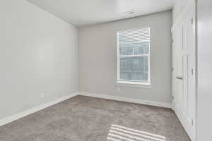 Interior space featuring light colored carpet