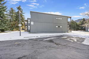 View of side of property featuring a mountain view and a balcony