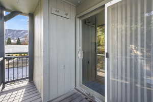 Entrance to property featuring a mountain view and a balcony