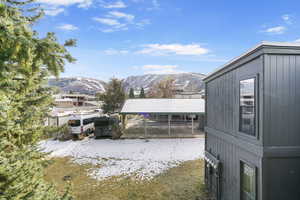 View of yard featuring a carport and a mountain view