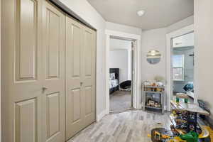 Corridor featuring light hardwood / wood-style floors